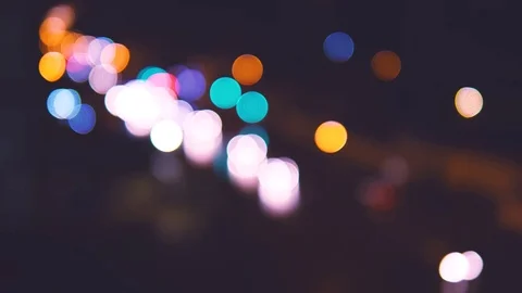 Handheld: Traffic lights at night blurry, car traffic lights moving Stock Footage 90553448