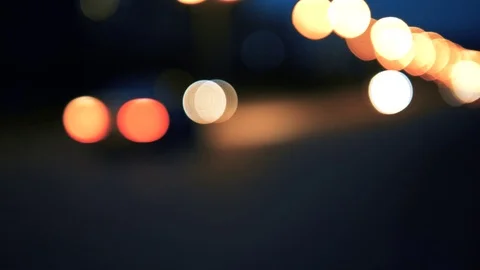 Handheld: Traffic lights at night blurry, car traffic lights moving Stock Footage 90652300