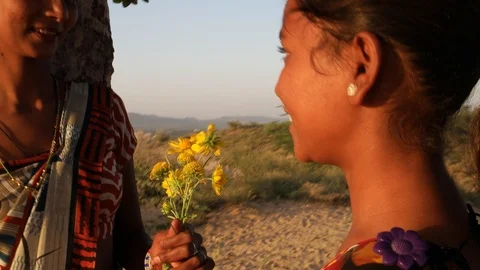 Handheld two girlfriend sharing flowers waiting for lovers romantic under  Stock Footage 92893733