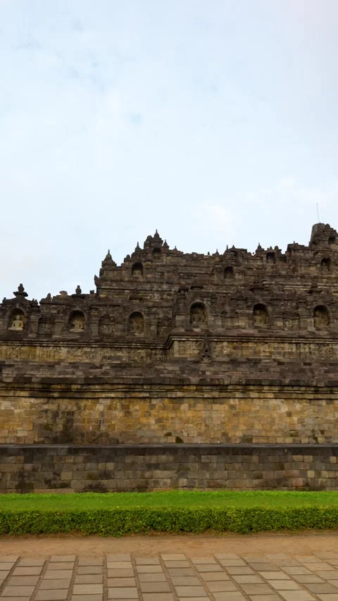 Handheld vertical panning view, Borobudur Temple, Central Java, UNESCO Site Stock Footage 314888061