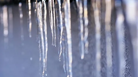 Handheld Video of Dripping Icicles With Selective Focus in Winter Stock Footage 325067732