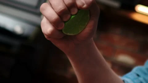 Handheld video of hand squeezing lime Stock Video Pond5
