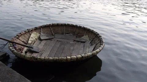 Handheld video showing an empty coracle in water. Stock Footage 152048374