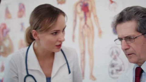 Handheld view of doctor working with tablet in doctor’s office. Stock Footage 145460331
