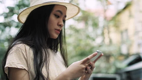 Handheld view of focused woman using mobile phone Stock-Footage 126025551