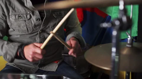 Handheld view of man enthusiastically playing drums Stock Footage 50207339