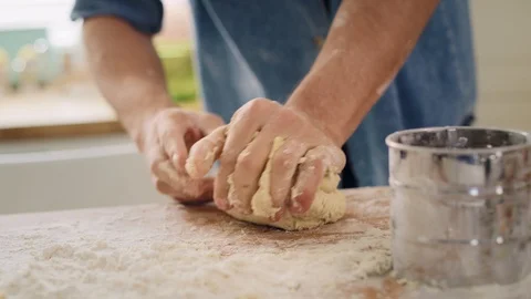 Handheld view of man’s hands kneading dough Stock Footage 124835325