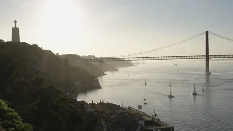 Handheld  view of Tagus River and Christ the Redeemer statue in Portugal Stock Footage 266435725