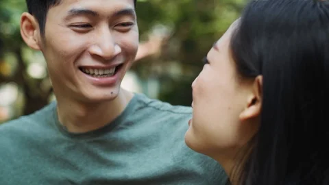 Handheld view of Vietnamese couple having happy time together Stock-Footage 125080484