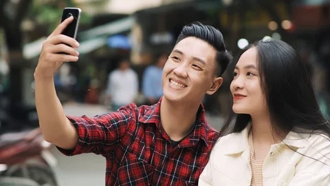 Handheld view of Vietnamese couple making a selfie Stockbeeldmateriaal 126026503