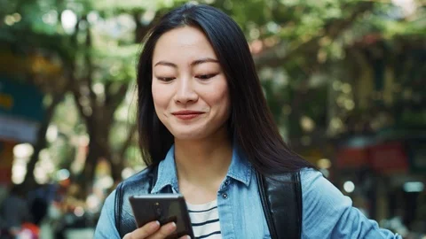 Handheld view of woman using mobile phone as navigation tool Stock Footage 125080683