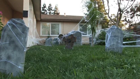Handheld Walk Through Front Yard Halloween Cemetery Stock Footage 91576582