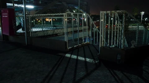 Handheld walking down a dark staircase in a carpark, to the bike parking lot. Stock Footage 306232949