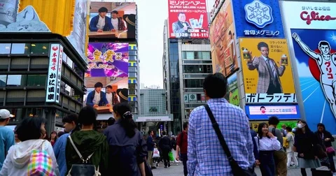Handheld Walking Footage In a Busy Crowd, Glico Man. Dōtonbori Osaka Japan 4K Video stock 80392893