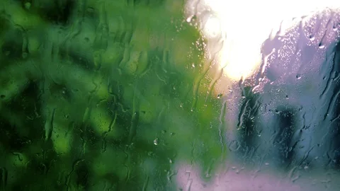 Handheld: Windscreen wipers during a rain, blurry natural background Stock Footage 90652288