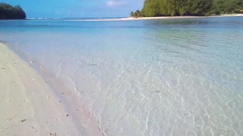 Handhold look up view of look out from Muri Beach Cook Islands to Koromiri islet Stock Footage 235318361