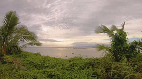 Handhold still view look out to sunset pacific horizon ocean sea with orange pin Stock Footage 258439892