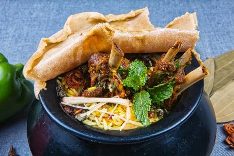 Handi Biryani with raw spices Stock Photos
