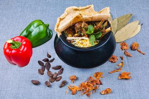 Handi Biryani with raw spices Stock Photos