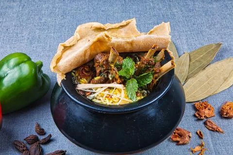 Handi Biryani with raw spices Stock Photos