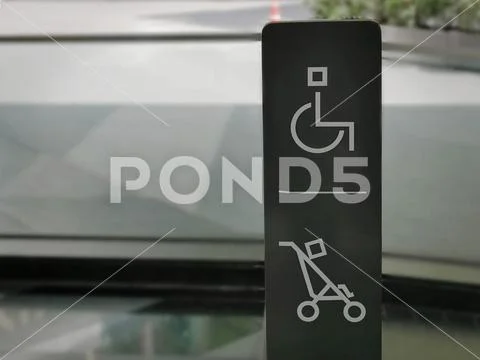 Handicap and Baby Trolley Symbols for Parking Assistance Stock Photos