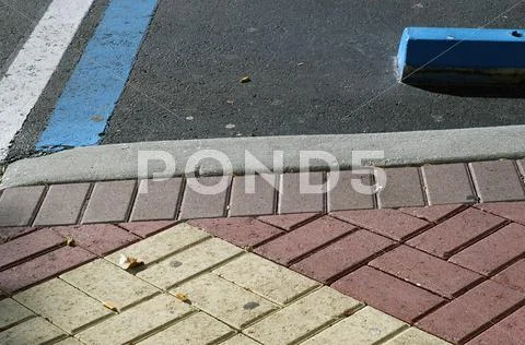 Handicap parking with sidewalk bricks Stock Photos