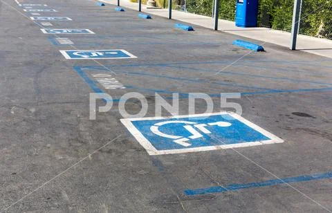 Handicap symbol on parking space Stock Photos