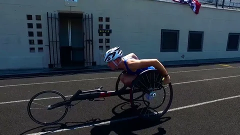 Handicapped and disabled veteran soldiers compete in track and field wheelchair Stock Footage