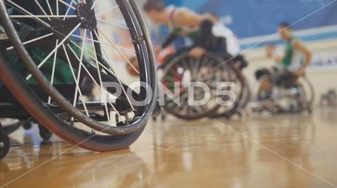 Handicapped basketball player in a wheelchair during sportive training Stock Photos