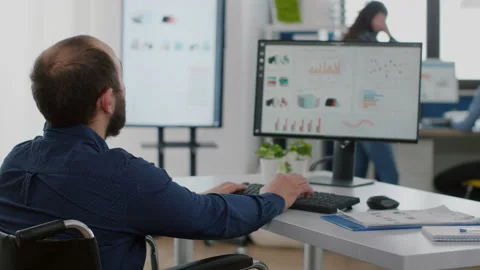 Handicapped entrepreneur typing on computer Stock Footage 154367328