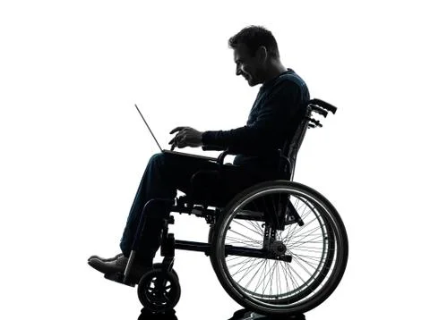 Handicapped man computing laptop computer  in wheelchair silhouette Stock Photos