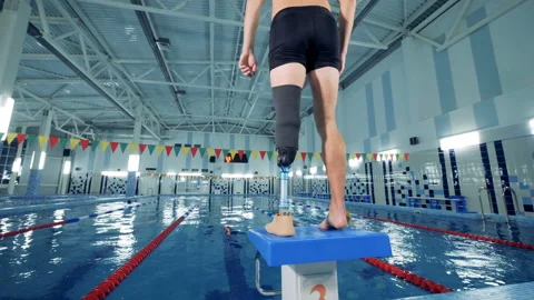 Handicapped man warming up before swimming, back view. Stock Footage 101229559