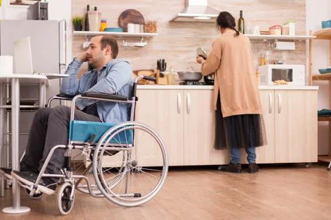 Handicapped man in wheelchair Stock Photos
