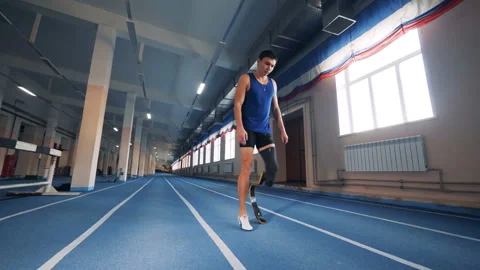 Handicapped runner warms up before training, close up. Stock Footage 99536444