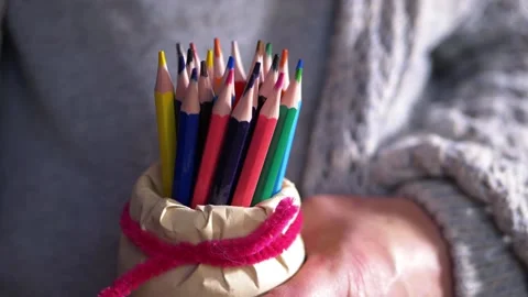 Handing choosing from selection of colored pencils Stock Footage 163178540