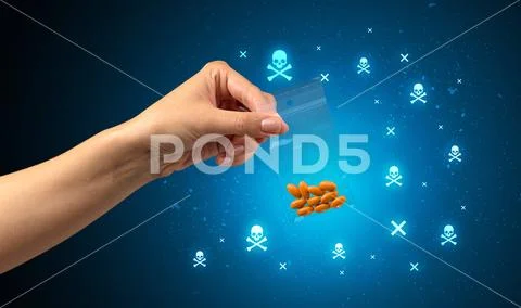 Handing over pills with skulls Stock Photos