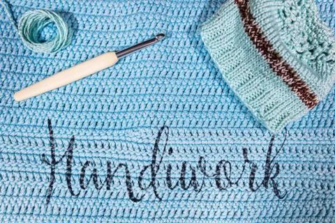 Handiwork, blue background for crochet and Knitting Stock Photos