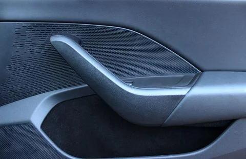 Handle and pocket on the inner panel of a car door Photos