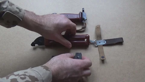 Handle and scabbard with spring of Soviet 6x4 bayonet-knife, military surplus. Vídeo Stock 329511743