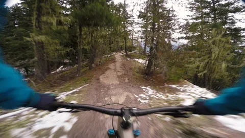 Handle Bar View Of Cyclist Riding A Trail In Winter With Views Of Snowy Mountain 스톡 동영상 114525964
