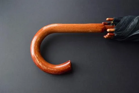 Handle of a black umbrella Stock Photos