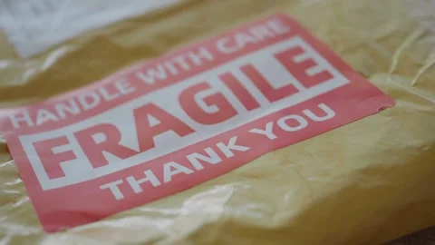 Handle with care package preparation for safe delivery 動画素材 310813307