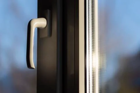 The handle of a closed window Stock Photos