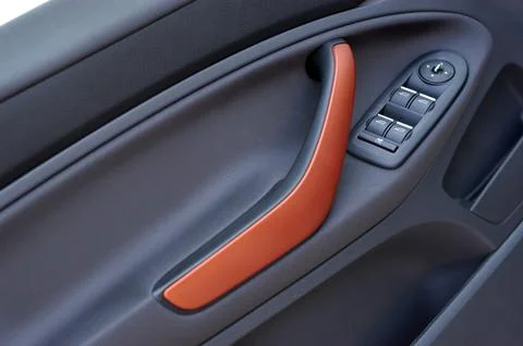 Handle on the door, car window control panel Stock Photos
