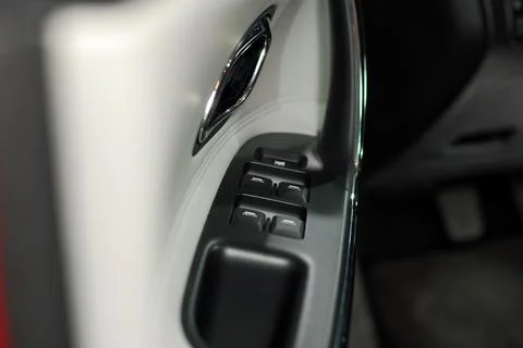 Handle on the door, car window control panel Stock Photos