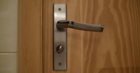 Handle door twitches. Someone is trying to enter. Stock Footage 87861659