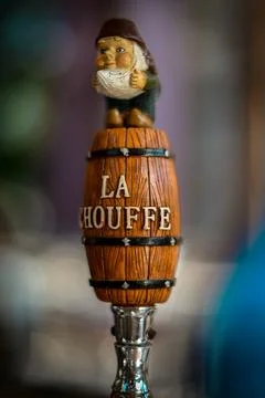 Handle of draft beer on bar counter Stock Photos