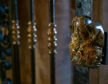 Handle of a gate with artistic statue Stock Photos