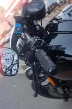 Handle on the handlebars of a motorcycle close-up Stock Photos