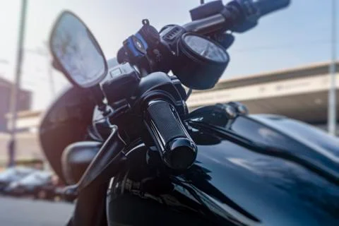 Handle on the handlebars of a motorcycle close-up Stock Photos